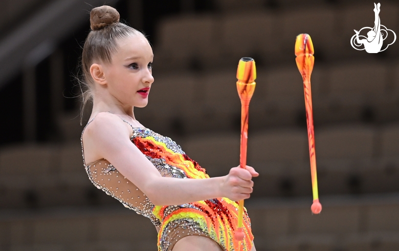 Lada Yakovleva during an exercise with clubs at a control training session