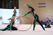 Gymnasts during an exercise with hoops