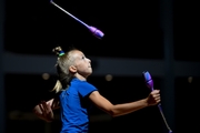 Gymnast during an exercise with clubs