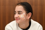 Academy student Anna Vakulenko in the face painting area