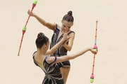 Gymnasts during an exercise with clubs