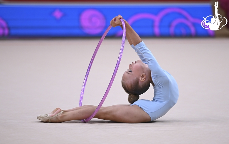 Young gymnast during an exercise with a hoop at the mAlinka tournament