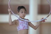 A gymnast from China during the hoop exercise when training