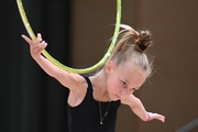 Young gymnast with hoop during selection