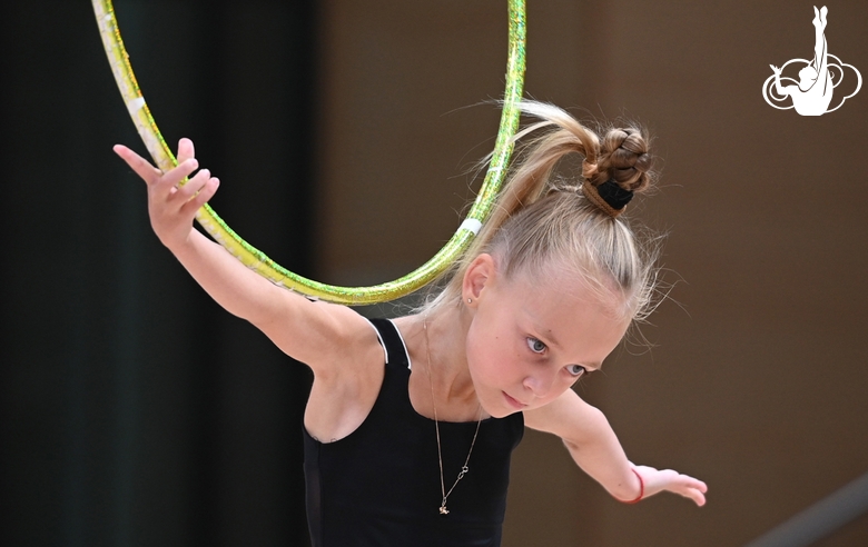 Young gymnast with hoop during selection