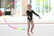 Young gymnast in a training class at the Academy