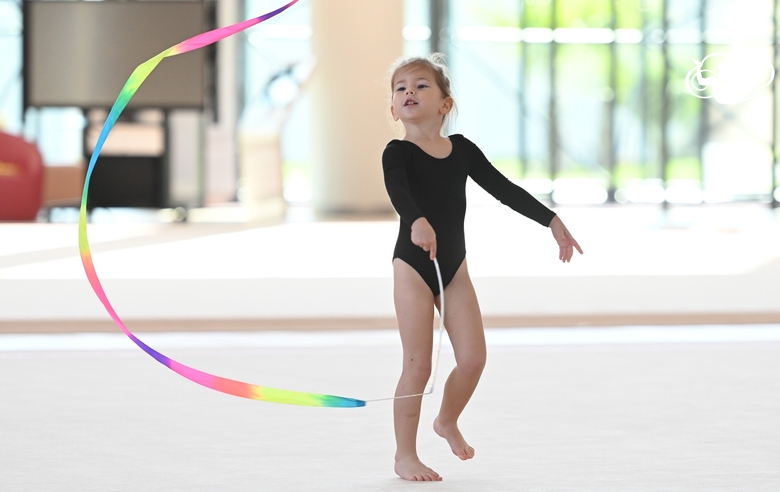 Young gymnast in a training class at the Academy