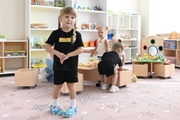 Young gymnast in a training class at the Academy