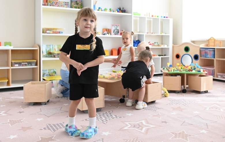 Young gymnast in a training class at the Academy