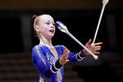 Young gymnast Olga Chernykh from Novosibirsk during an exercise with clubs