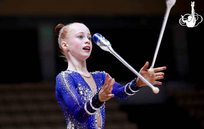 Young gymnast Olga Chernykh from Novosibirsk during an exercise with clubs