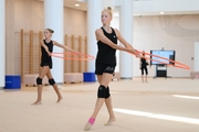 Gymnasts performing an exercise with hoops