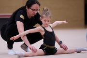 Academy coach Alla Mishenina with a young gymnast during the selection process