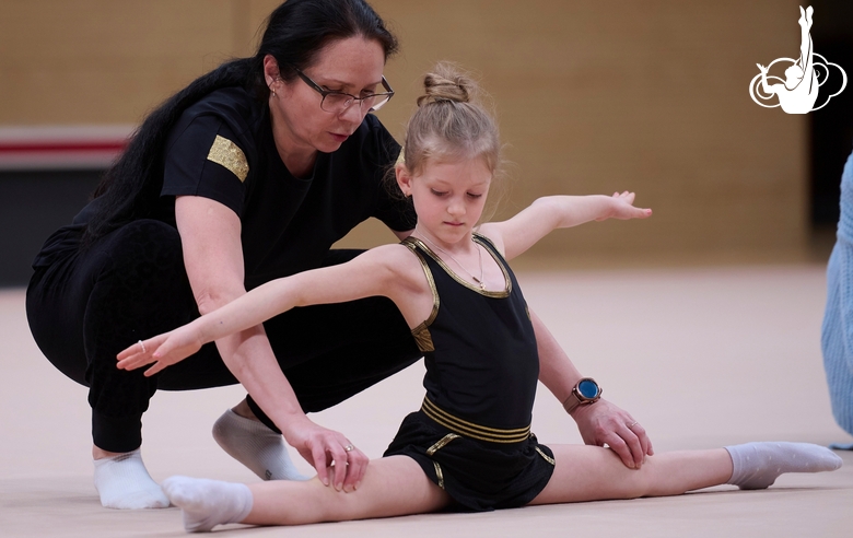 Academy coach Alla Mishenina with a young gymnast during the selection process