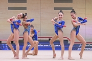 Gymnasts during an exercise with clubs