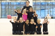 Academy Coach Alla Mishenina with young gymnasts