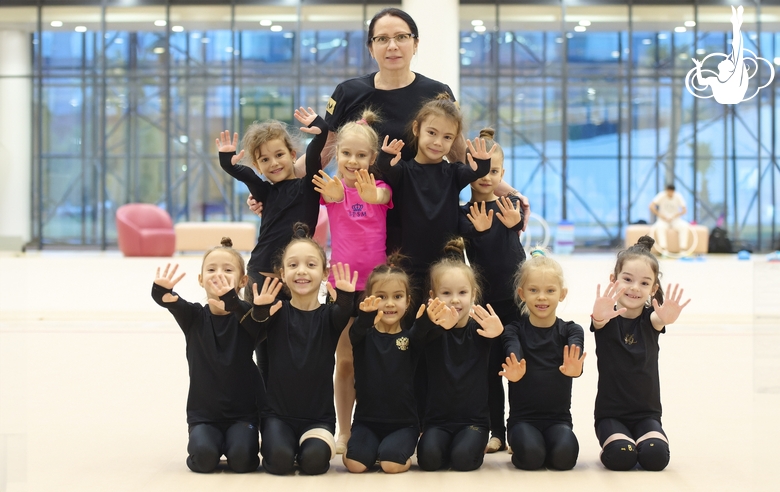 Academy Coach Alla Mishenina with young gymnasts