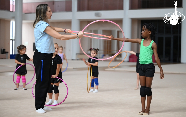 Academy coach Olesya Kovaleva with gymnast Nkenko Sita Davina Chanselvi during the hoop exercise