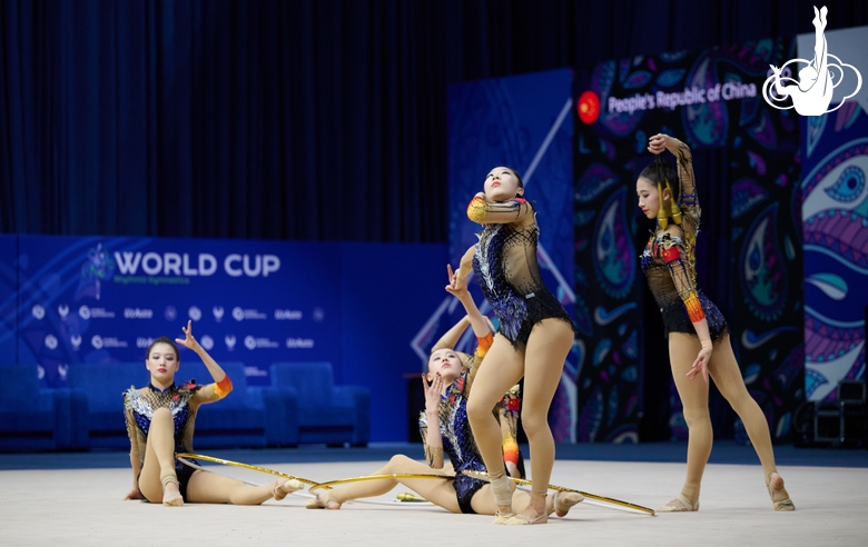 Team China during an exercise with hoops and clubs