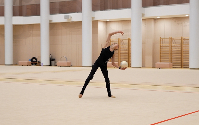 Alina Kabaeva gives Arina Kovshova some tips on how to maintain tempo in her ball routine