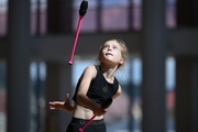 Gymnast during an exercise with clubs