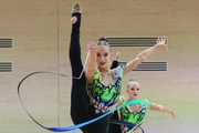 Gymnasts during an exercise with balls and ribbons