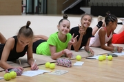 Gymnasts during a session with a psychologist at the training camp in the Academy