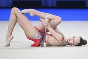 Daria Grokhotova during an exercise with clubs