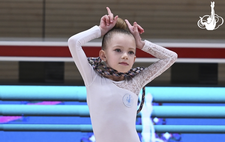 Young gymnast during an exercise with a jump rope at the mAlinka tournament