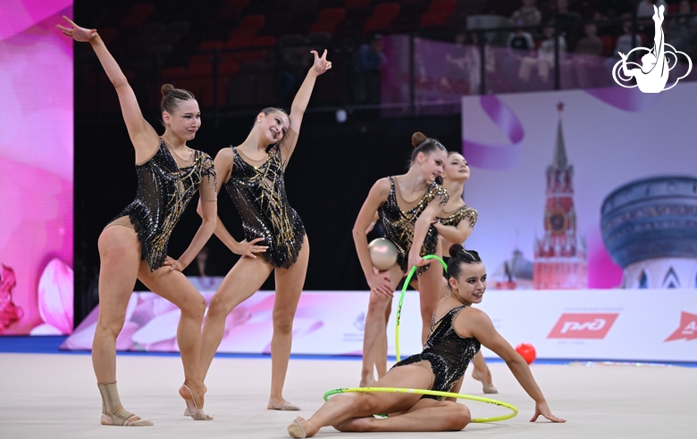 Group team gymnasts from the Penza Region during an exercise with hoops and balls