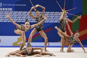 Gymnasts during an exercise with clubs