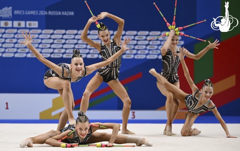 Gymnasts during an exercise with clubs