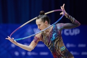 Takhmina Ikromova during an exercise with hoop