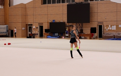 Alina Kabaeva gives pointers to Yana Zaikina on how to make the transitions more logical in her clubs routine