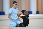 Academy coach Elizaveta Chernova with gymnast Nkenko Sita Davina Chanselvi during the hoop exercise