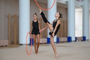 Gymnasts performing an exercise with hoops