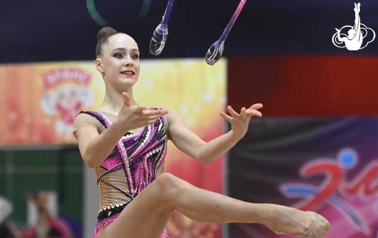 Arina Gvozdetskaya during an exercise with a clubs