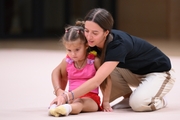 Academy coach Elizaveta Chernova with a young gymnast during the selection