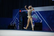Aruuke Kurmanbekova during an exercise with clubs