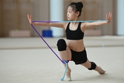 A Chinese gymnast performs an exercise with a jump rope