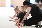 Academy Coach Alla Mishenina with young gymnasts during the training session