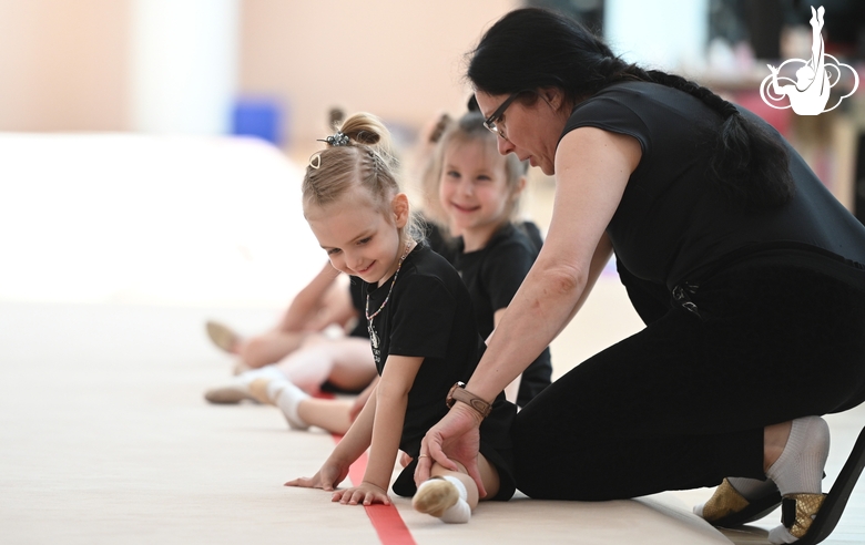 Academy Coach Alla Mishenina with young gymnasts during the training session