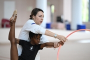 Academy coach Olesya Kovaleva with gymnast Nkenko Sita Davina Chanselvi during the hoop exercise