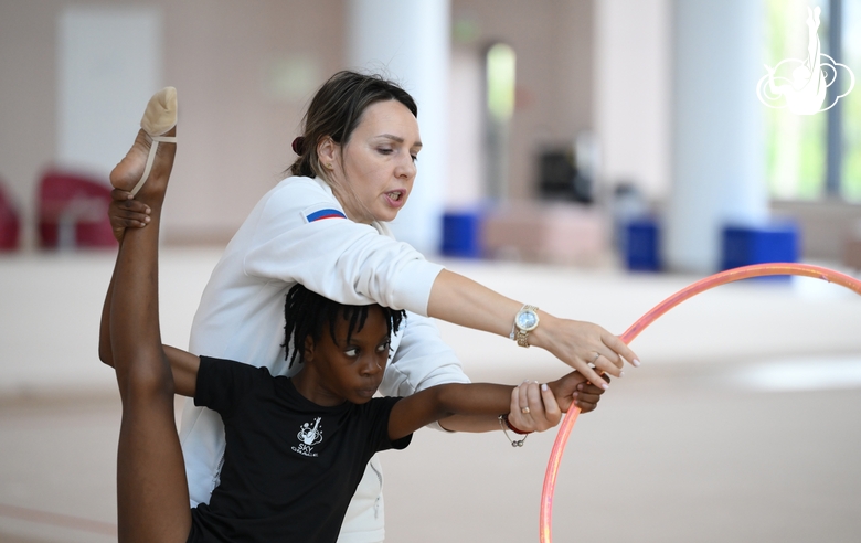 Academy coach Olesya Kovaleva with gymnast Nkenko Sita Davina Chanselvi during the hoop exercise