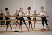 Gymnasts practice choreography during the recovery camp at the Academy