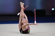 Alesya Naifonova during the exercise with clubs