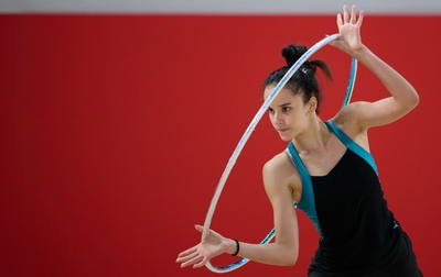 Cuban gymnasts are working on their routines at the Martial Arts Academy