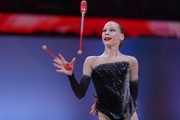 Ksenia Saliy during the exercise with clubs
