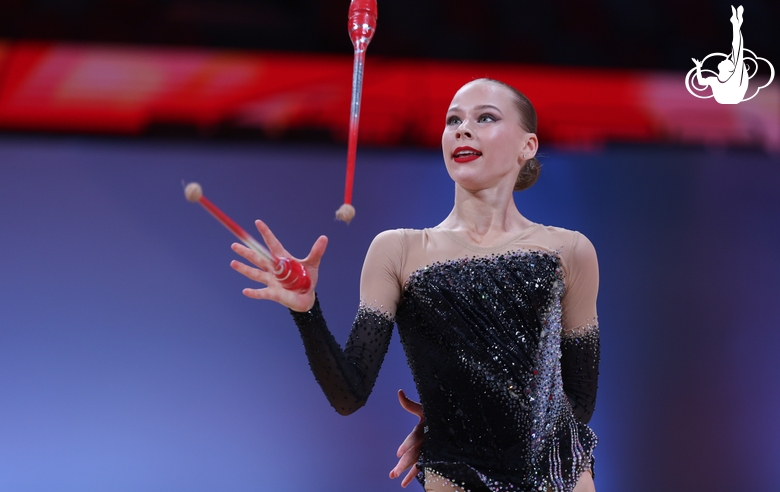 Ksenia Saliy during the exercise with clubs