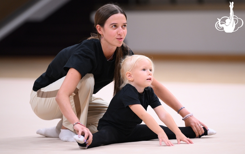 Academy coach Elizaveta Chernova with a young gymnast during the selection